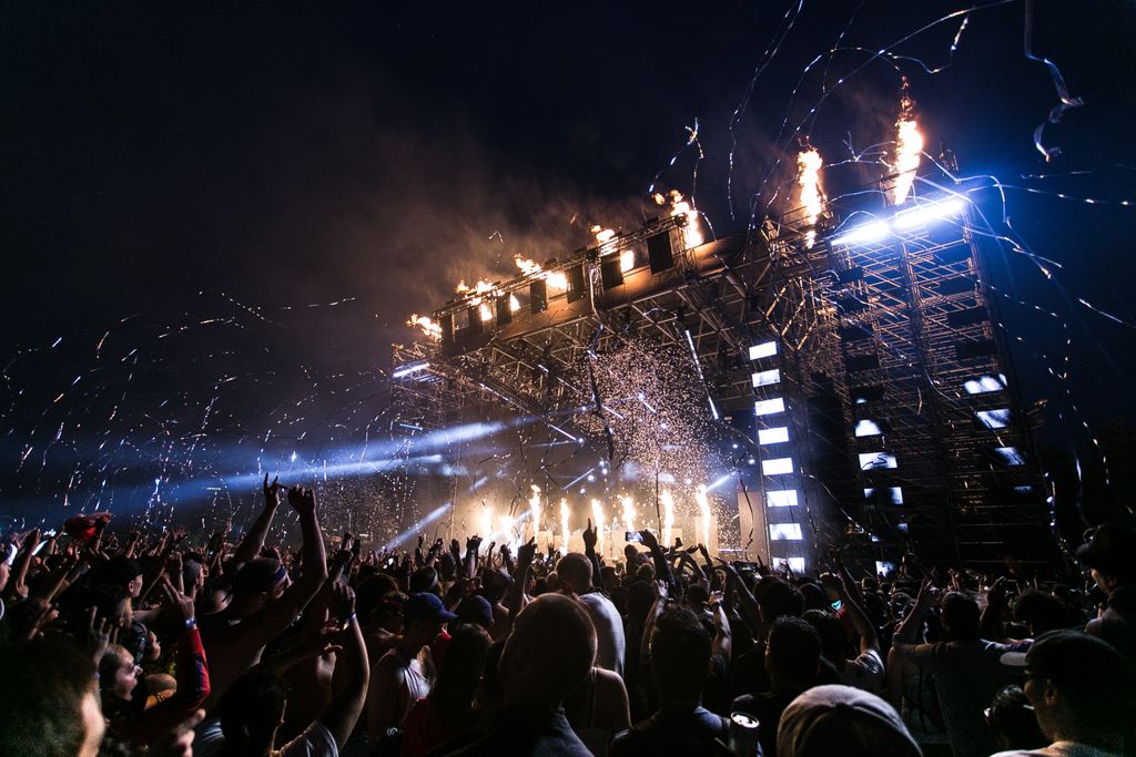 Festival crowd with lights and stage — UK festivals host millions of attendees each summer